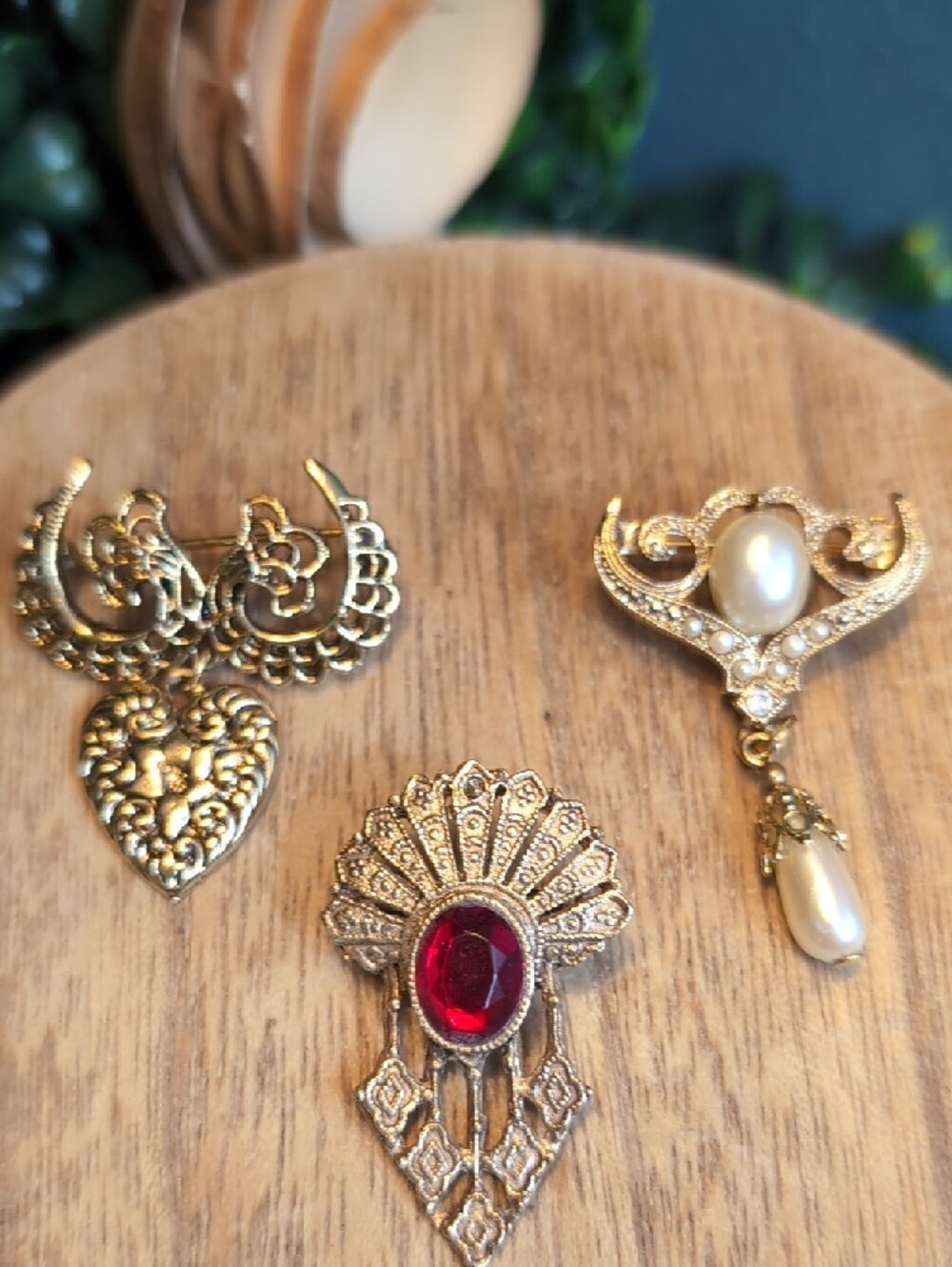 Vintage-Inspired Gold Tone Brooch Collection with Pearl and Red Gem Accents